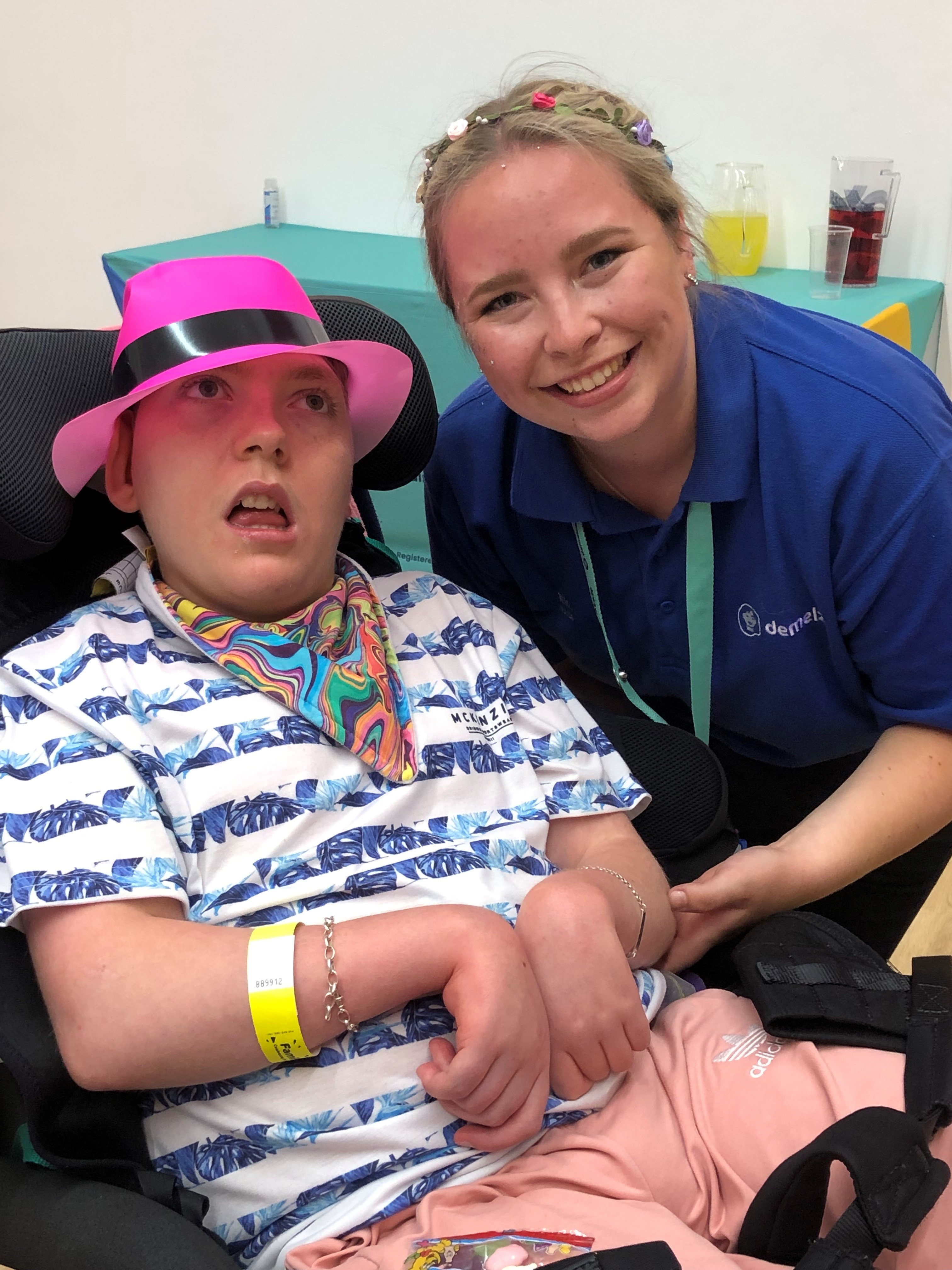 Young person and nurse taking picture together