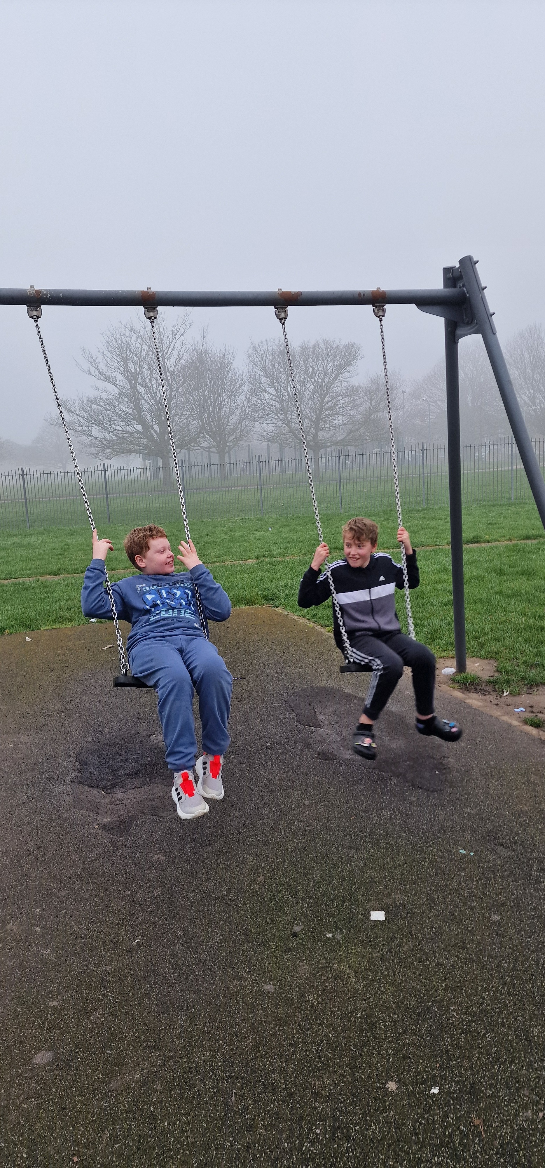 Ralph and his brother Freddie playing on the swings
