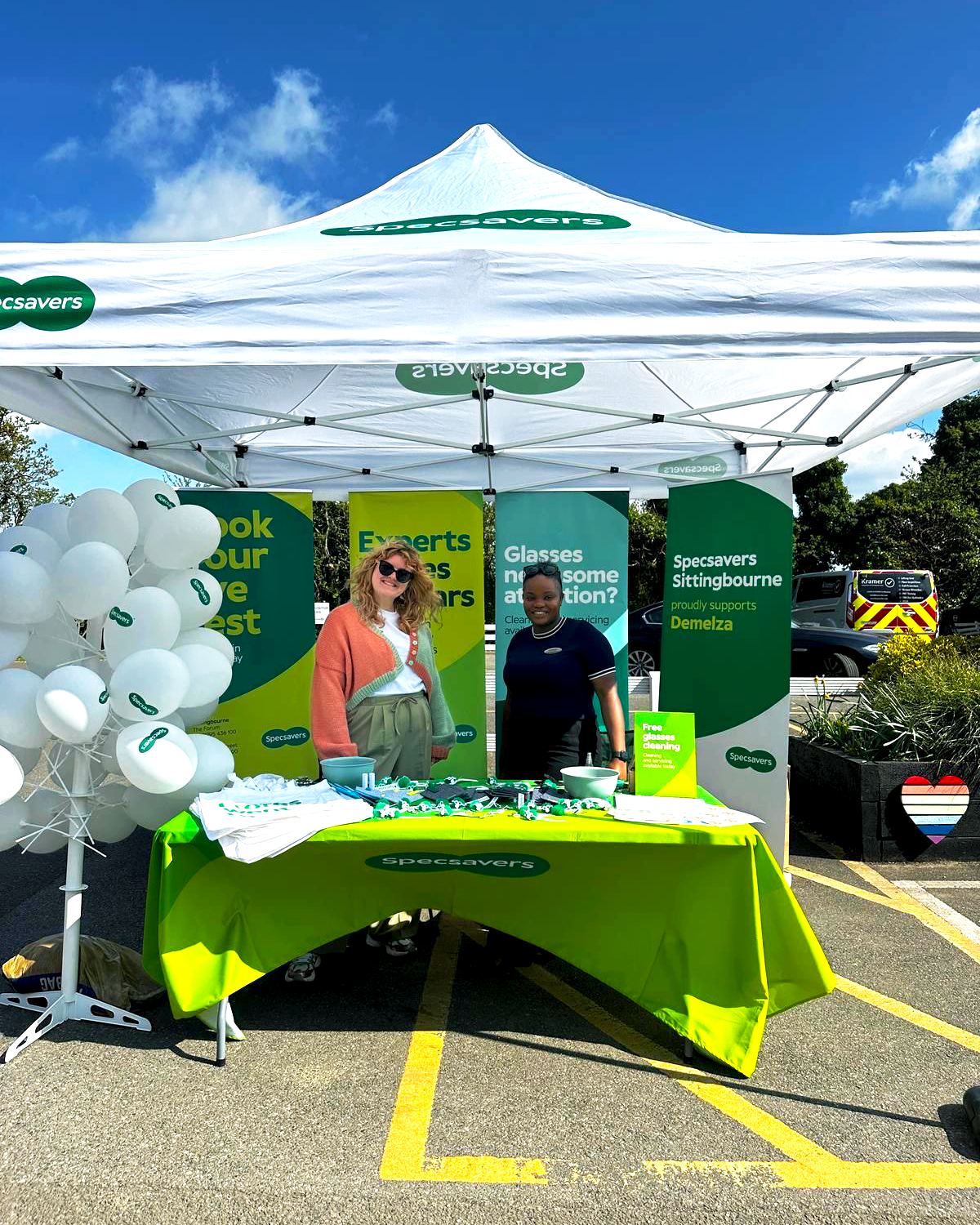 Two women standing at the Specsavers stall which was set up at the Demelza Easter Trail