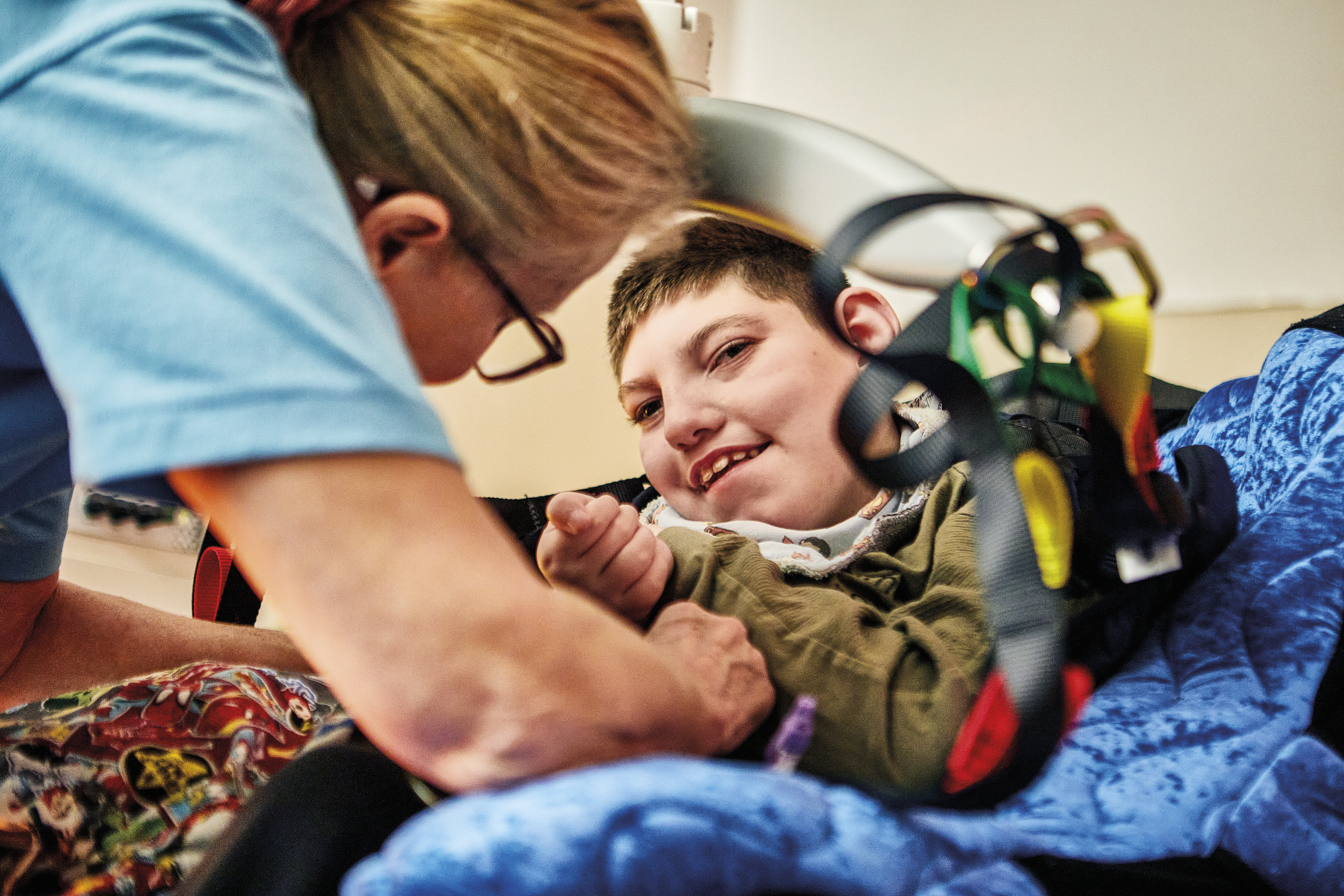 A nurse helping a child get comfortable