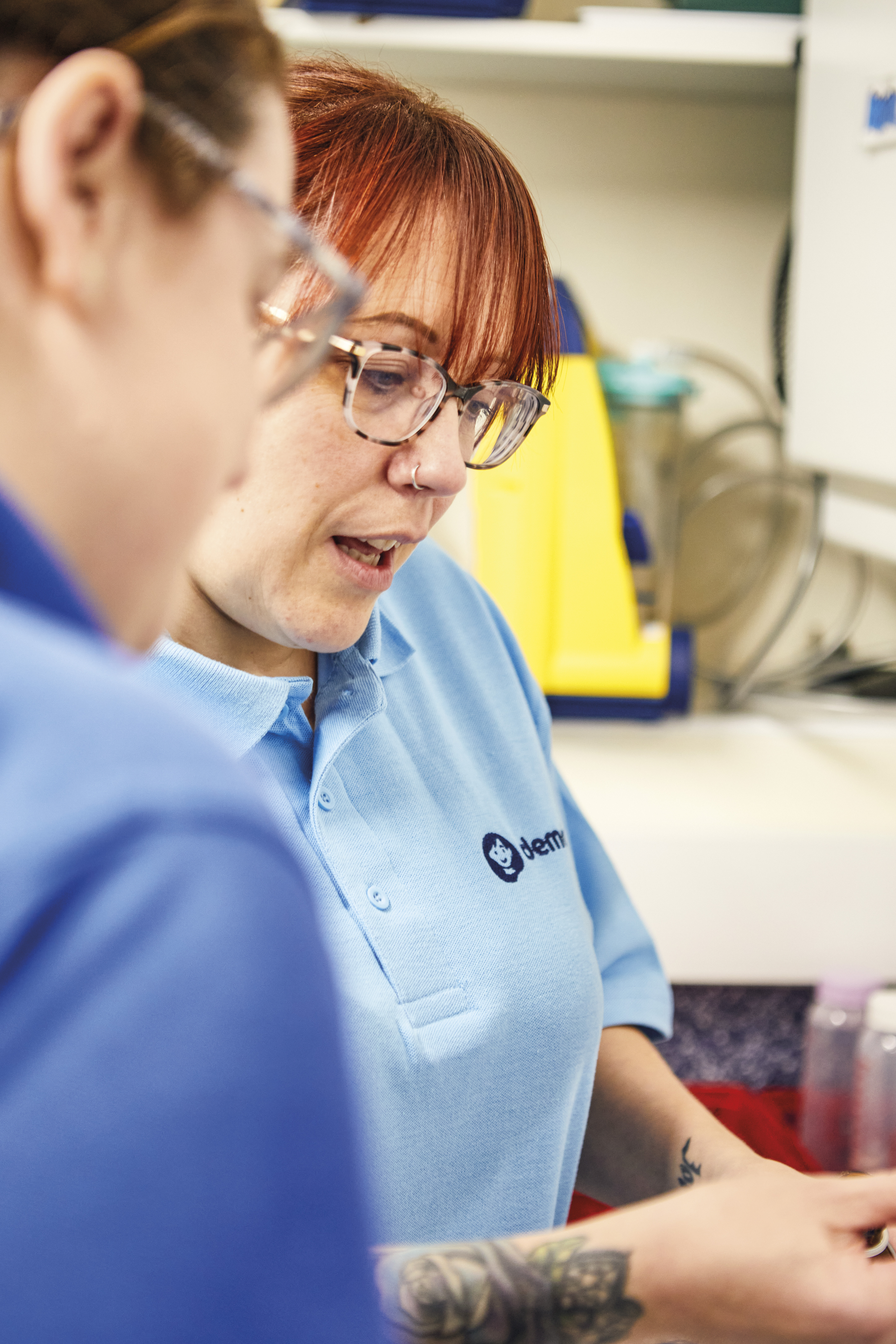 Two nurses sorting out medicine 