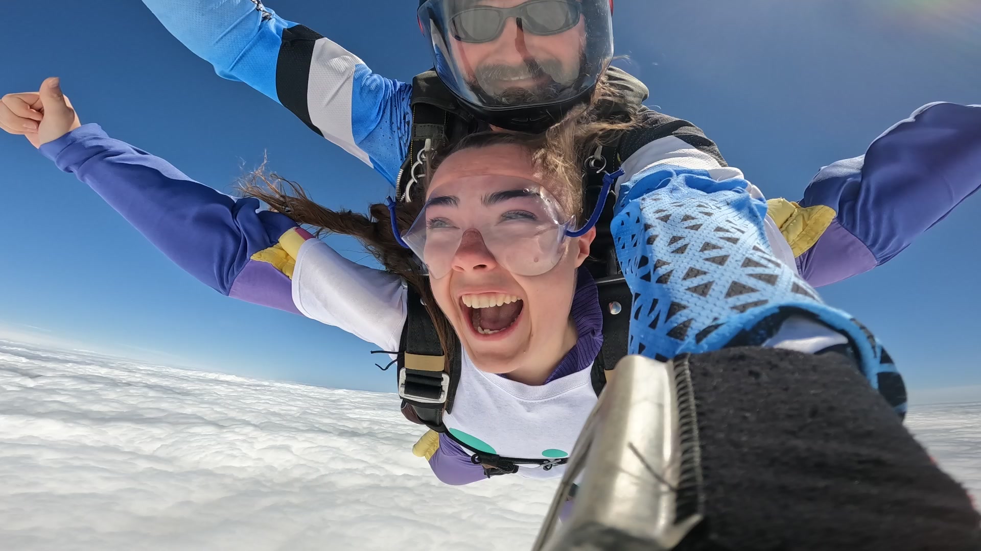 A Demelza fundraising skydiving alongside an instructor