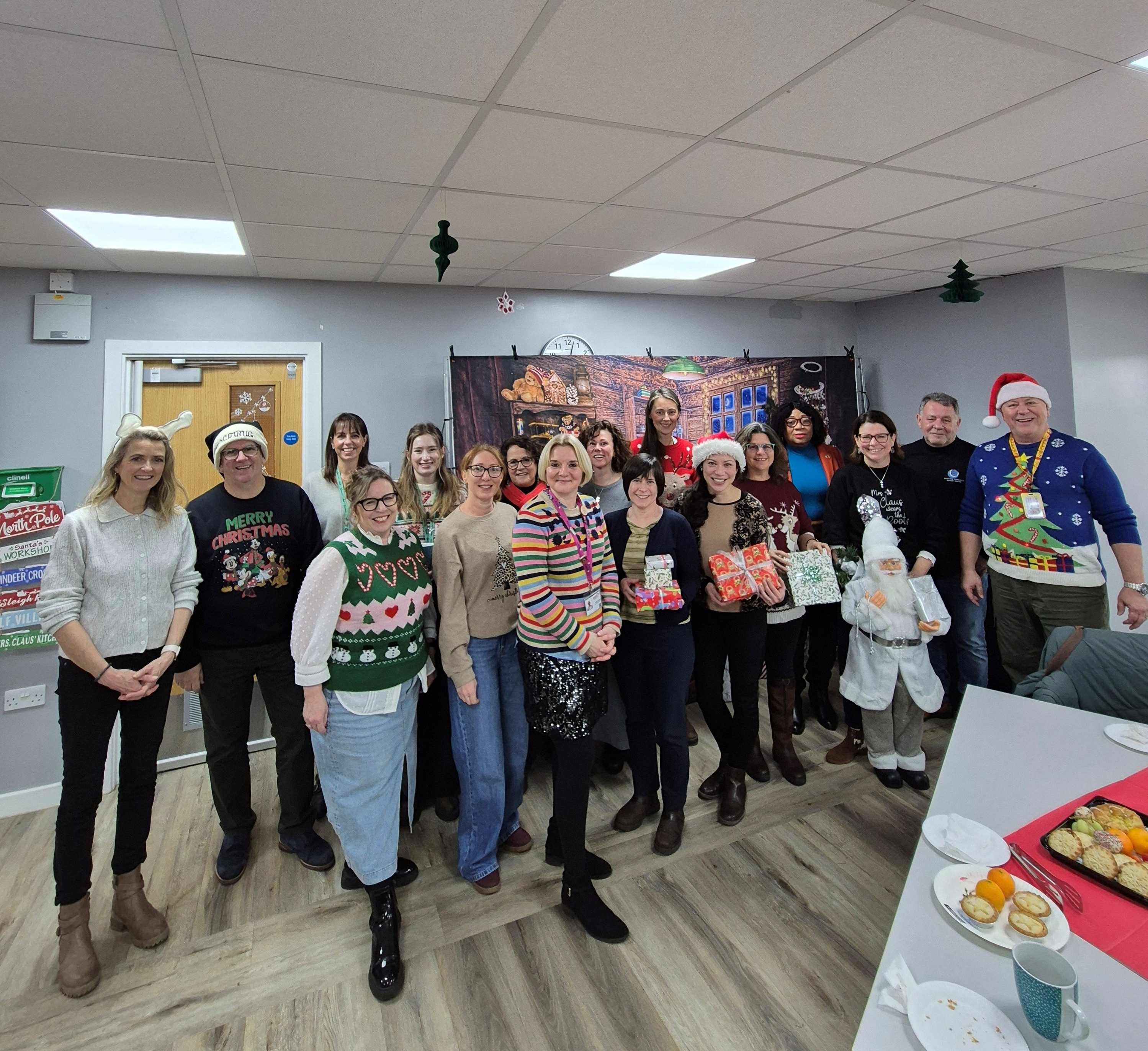 Members of the VCSE in their Christmas jumpers at a festive get together at Demelza