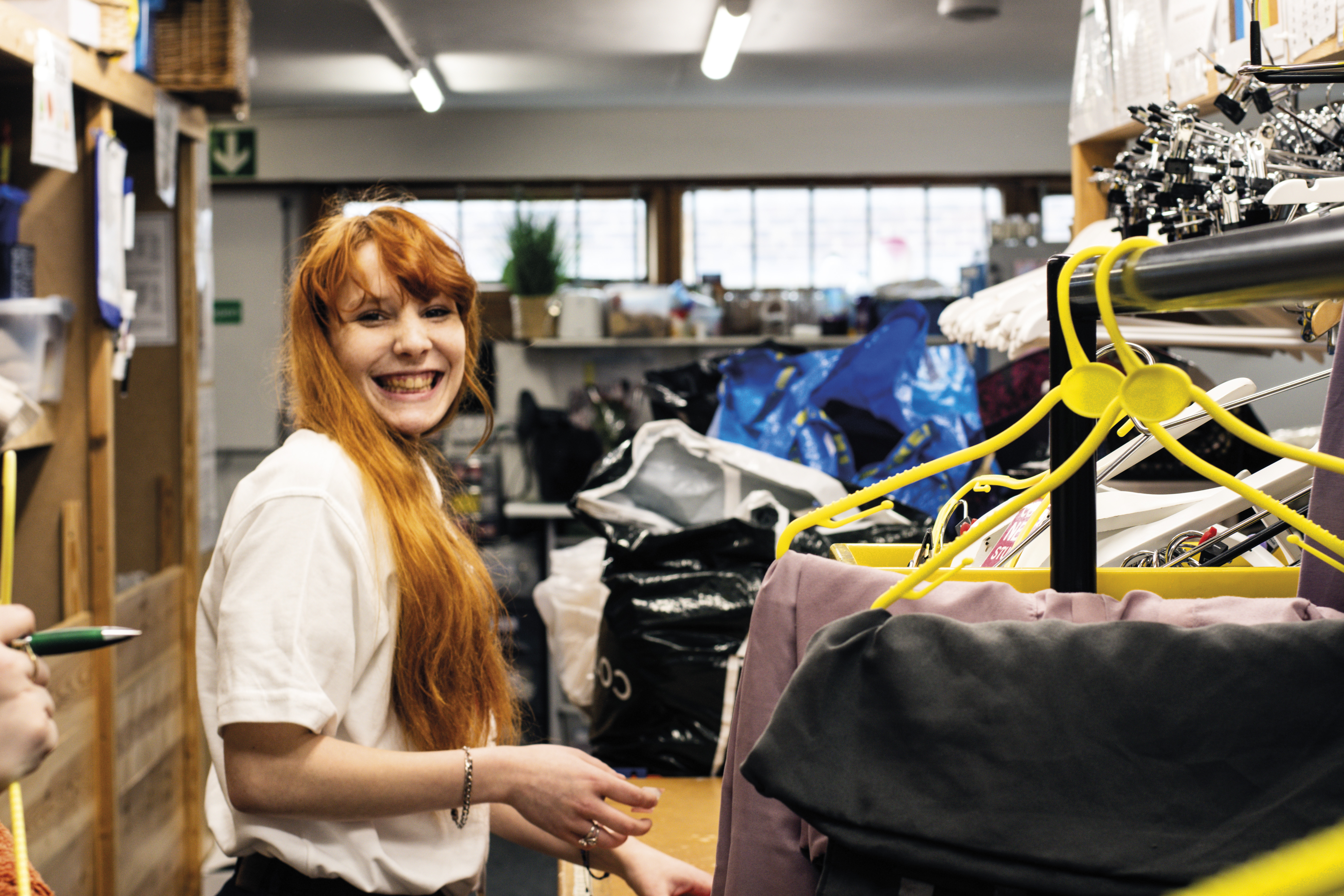 Volunteer Amber sorting retail donations