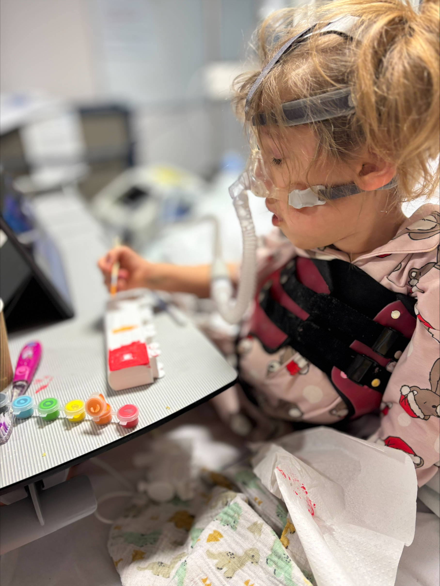 Niamh, who has spinal muscular atrophy, painting
