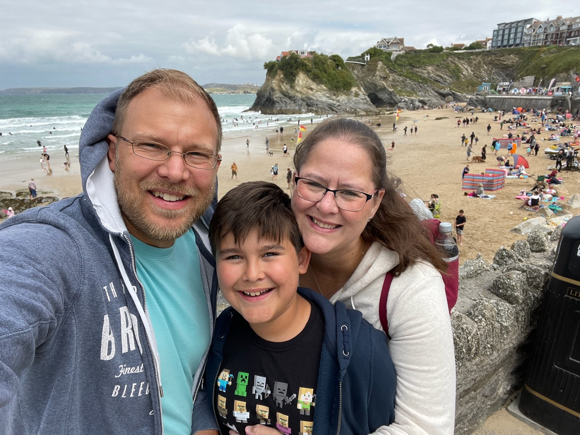 Joshua and his parents at the beach