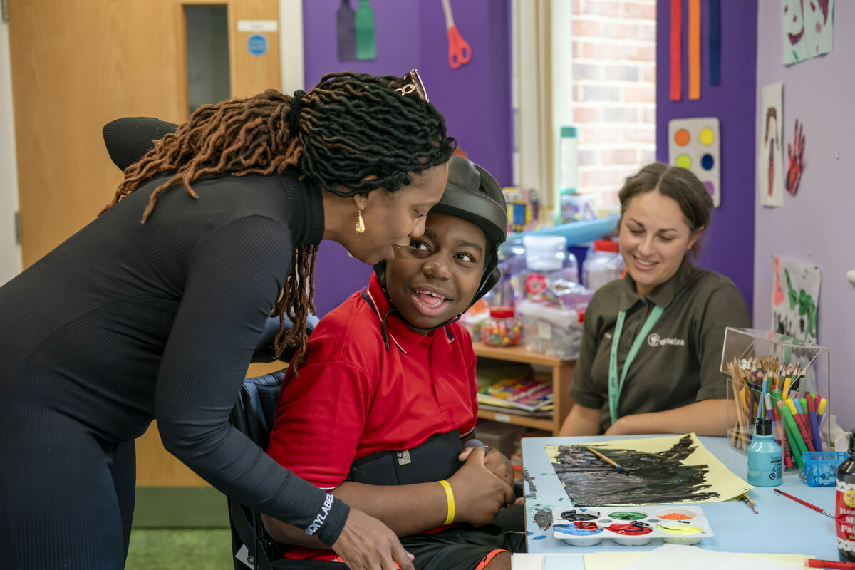 Zyan enjoying art activities with his mum and Rachel in the art room at Demelza South East London.