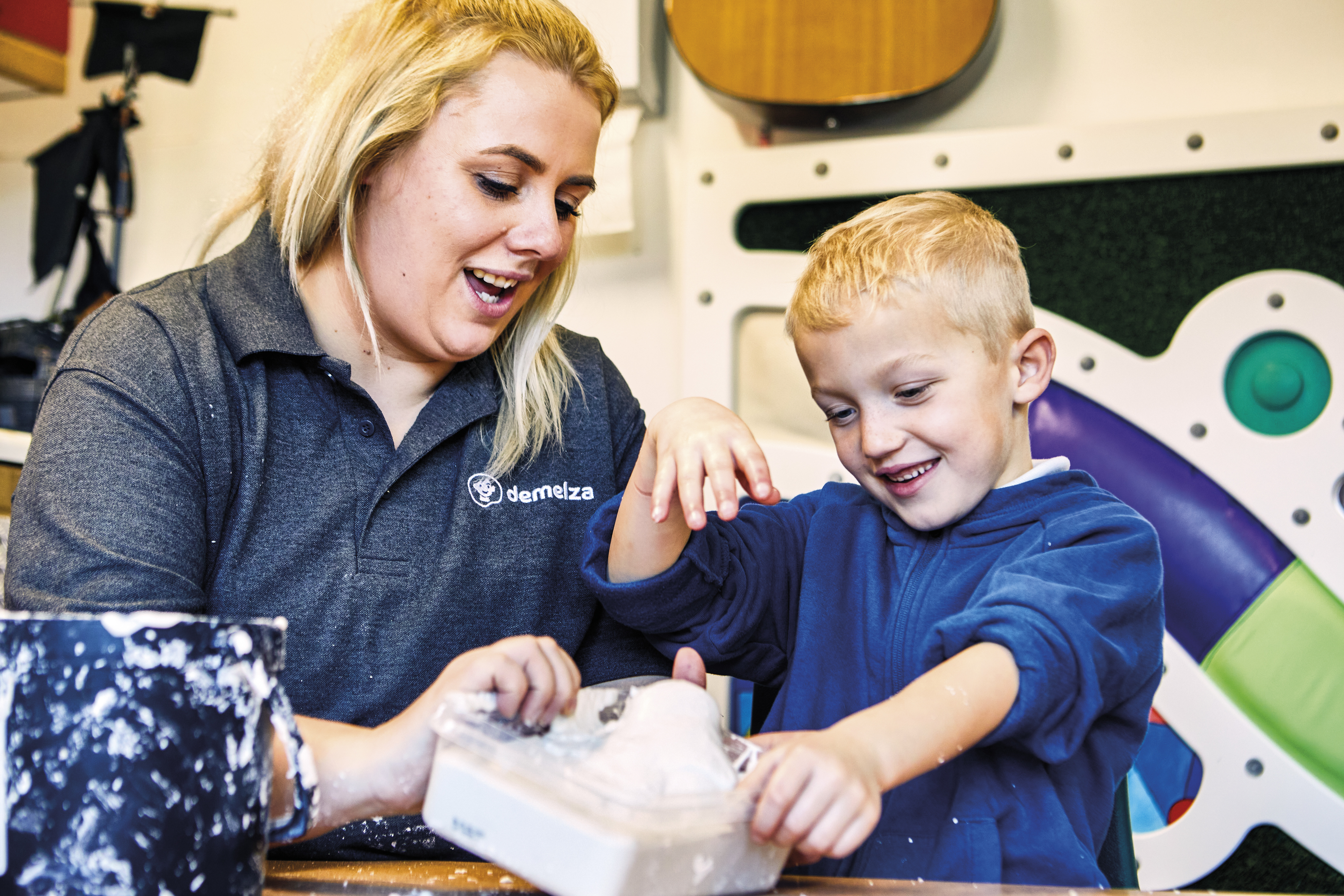 Image of child and staff doing memory making