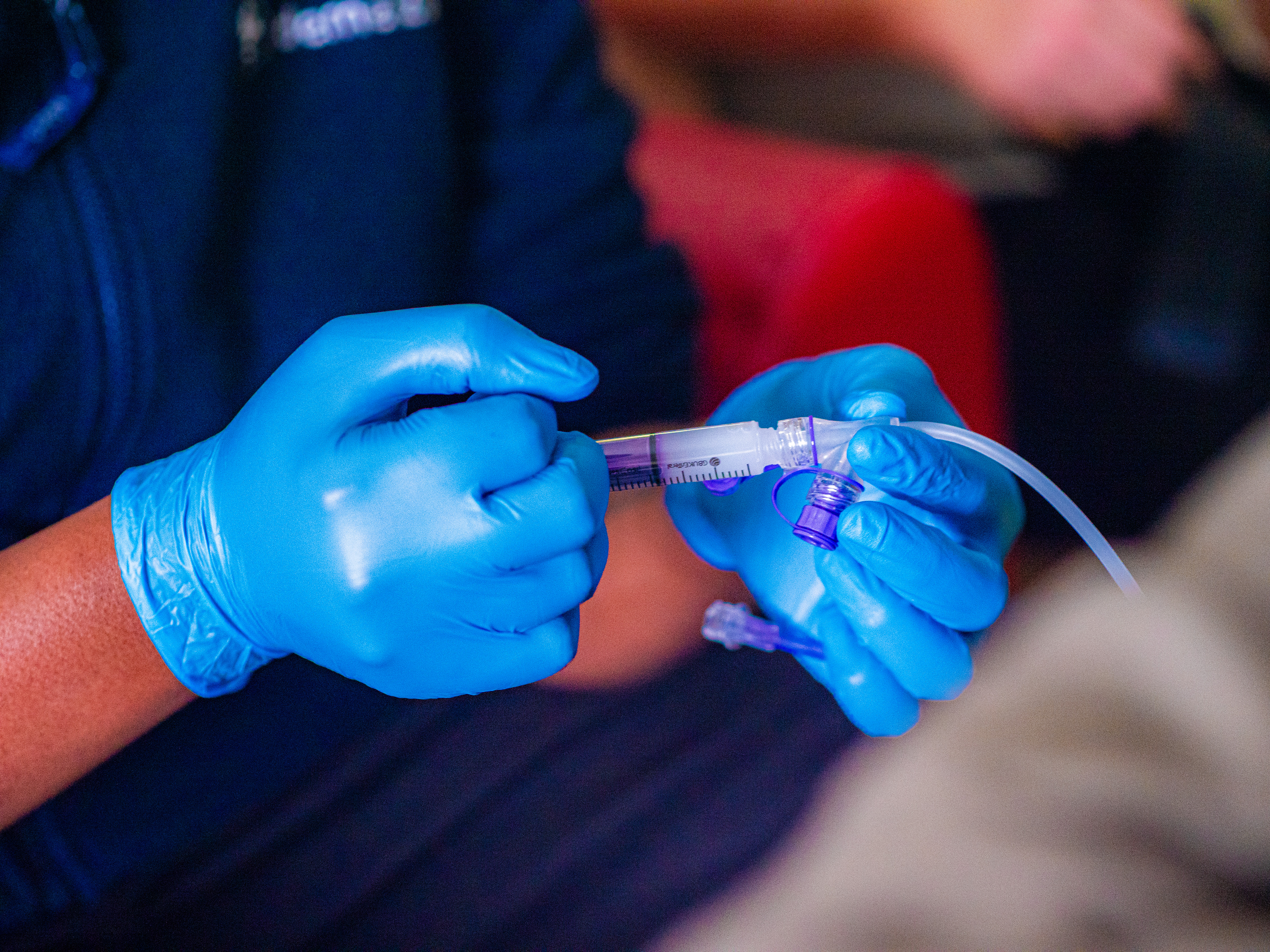 A nurse administering medicine to a child